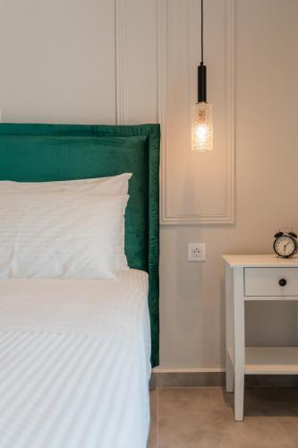 Ένα ή περισσότερα κρεβάτια σε δωμάτιο στο Melena Premium Suites