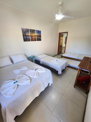 Postel nebo postele na pokoji v ubytování Pousada Canto do Sabiá