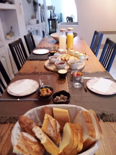 a table with a bunch of food on it at La maison perchee in Aigues-Mortes