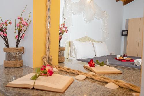 a mirror on a counter with a bed in a room at Elena's Seaside Apartments & Studios in Agios Gordios