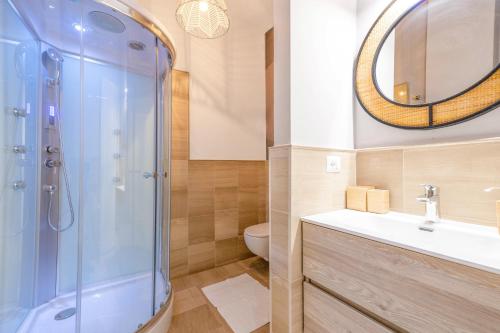 a bathroom with a shower and a sink and a toilet at City Gate - luxury suites in Bari