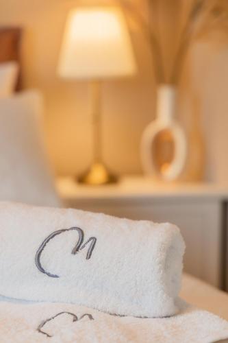 Ένα ή περισσότερα κρεβάτια σε δωμάτιο στο Melena Premium Suites