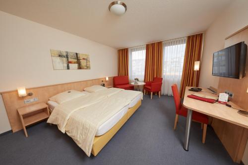 Ένα ή περισσότερα κρεβάτια σε δωμάτιο στο Hotel Filderland - Stuttgart Messe - Airport