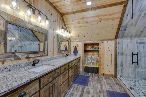 a bathroom with two sinks and a large mirror at Gorgeous Broken Bow Family Home with Private Hot Tub in Broken Bow