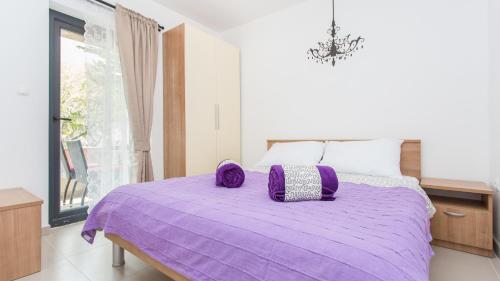 Ένα ή περισσότερα κρεβάτια σε δωμάτιο στο Apartments Memories