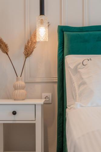 Ένα ή περισσότερα κρεβάτια σε δωμάτιο στο Melena Premium Suites
