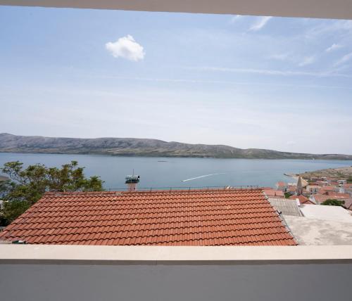 a view of the water from the roof of a building at L'infini Sea View apartments Zubovići in Zubovići