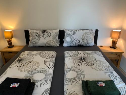 a bedroom with two beds with pillows on it at Katharina Boardinghouse in Osnabrück