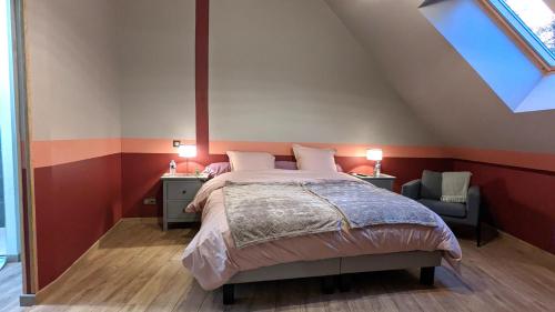 a bedroom with a large bed and a window at La Ferme du Château in Beire-le-Châtel