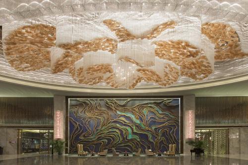 a pile of donuts on a ceiling in a building at Wanda Vista Nanning in Nanning