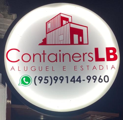 a sign for a restaurant with a building on it at Container LB CAXU in Boa Vista