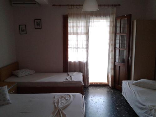 Postel nebo postele na pokoji v ubytování Miltos rooms