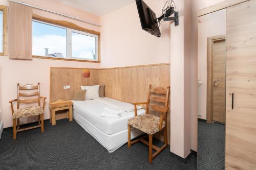 מיטה או מיטות בחדר ב-Hotel Orlando