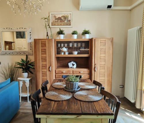 a dining room table with pillows on top of it at Elegant Sweet Apt Cernobbio Centro in Cernobbio