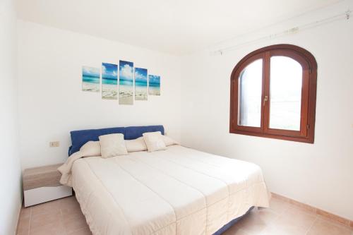 Ένα ή περισσότερα κρεβάτια σε δωμάτιο στο Villino Funtana 2