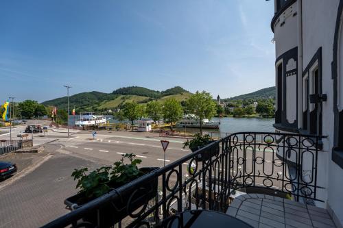a balcony of a building with a view of a river at Moselresidenz Bellevue Alf Apartment Moselblick in Alf