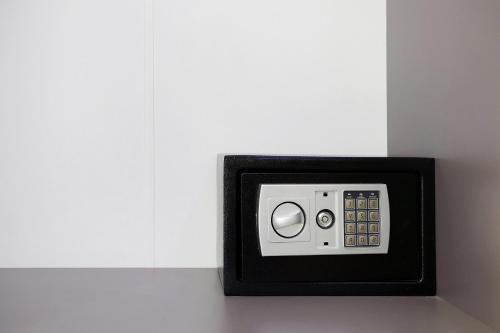 a black and white safe in a white wall at Villa Dionysia Studio S7 in Alikanas