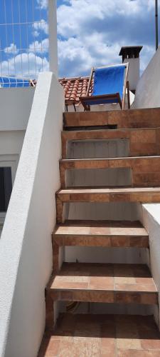 a set of stairs leading to a pool on a house at Casa Esmar in Odemira