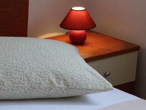 Кровать или кровати в номере La Gatta Apartmani