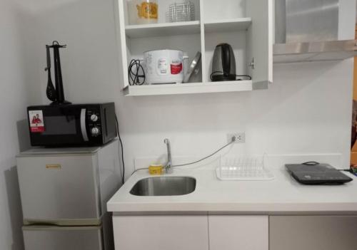 A kitchen or kitchenette at SM Bicutan Affordable Rooms
