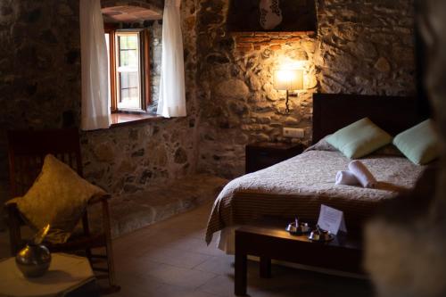 Ένα ή περισσότερα κρεβάτια σε δωμάτιο στο Hotel Mas 1670 - Adults Only