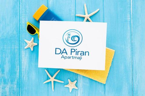 a sign for aarmaarmaarmaarmaarma initiative with starfish on a table at Apartmani DA in Piran