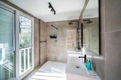 a bathroom with a white sink and a shower at Charming 10 person Villa in Sevilla in Tomares