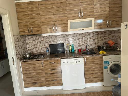 a kitchen with a sink and a dishwasher at Квартира в Kultur 2+1 in Antalya