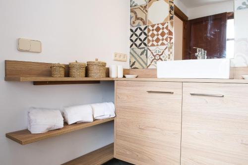 a bathroom with a sink and a counter with towels at Sant llorens - 4341-21 Mallorca in Sant Llorenç des Cardassar