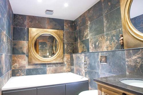 a bathroom with a sink and a mirror at The Shankly Hotel in Liverpool