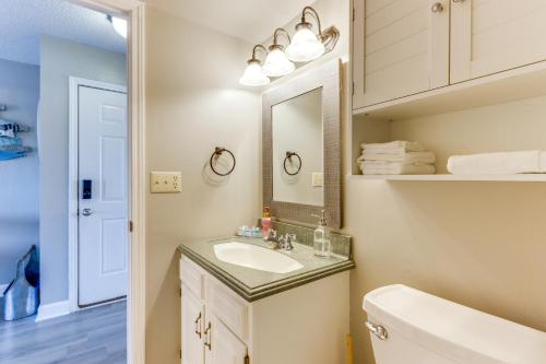 a bathroom with a sink and a mirror at Osage Beach Vacation Rental with Pool and Lakeview! in Osage Beach