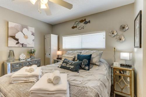 a bedroom with a bed with towels on it at Osage Beach Vacation Rental with Pool and Lakeview! in Osage Beach