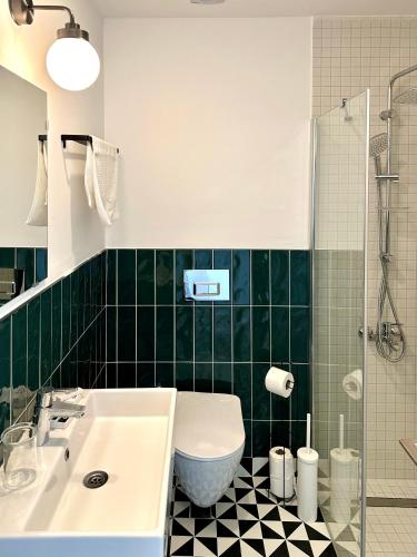 a bathroom with a sink and a toilet and a shower at BE BOLD HOSTEL in Antalya