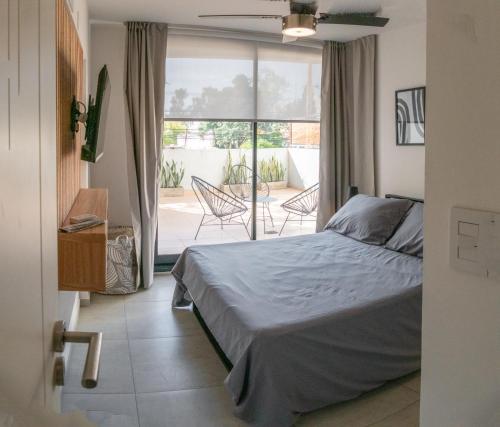 Postel nebo postele na pokoji v ubytování Departamentos General Paz by Lugar