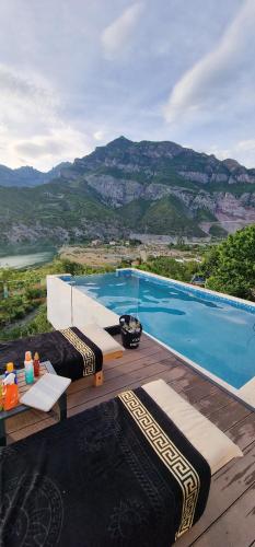 a swimming pool with a view of a mountain at Koman Paradise by Romina in Shkodër