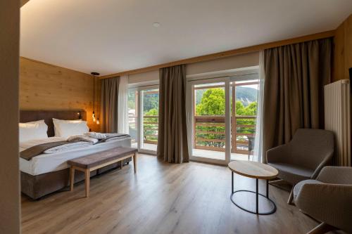 A bed or beds in a room at Hotel Lido - slow & natural living