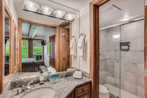 a bathroom with a sink and a shower at Interlude Condominiums 2-Bedroom Unit 205 in Snowmass Village