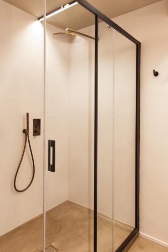a glass shower in a room with a ceiling at Terra di Gradara in Gradara