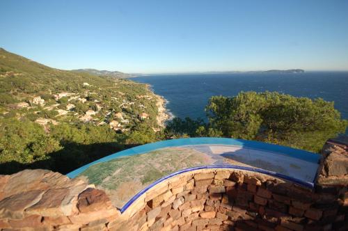 a view of the ocean from the top of a hill at Magnifique petit cocon bord de mer in Le Pradet