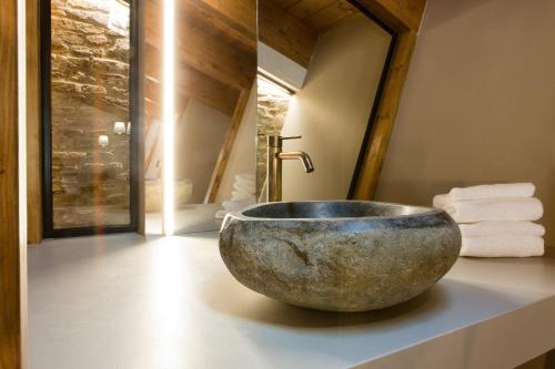 a bathroom with a bowl sink on a counter at Terra di Gradara in Gradara