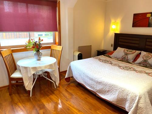 Postel nebo postele na pokoji v ubytování Nubes Hotel