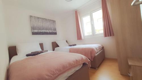 a room with two beds and a window at Two bedroom apartment Bambi in Vir