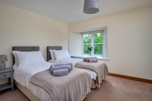 Finest Retreats - Victory Mill - Apartment Two tesisinde bir odada yatak veya yataklar