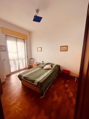 Postel nebo postele na pokoji v ubytování Condominio Ulivi
