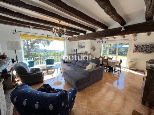 a living room with a couch and a table at CASA MAS NOU 24 in Platja  d'Aro