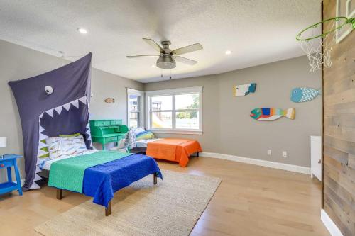 a childs bedroom with a bed and a table at Luxury St Petersburg Home with Pool and Bay Access! in St Pete Beach