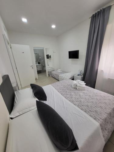 Katil atau katil-katil dalam bilik di New Era Rooms
