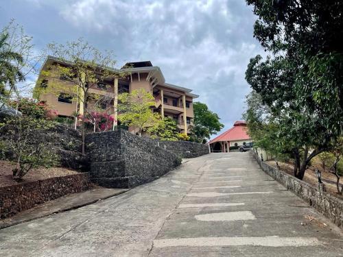 a house on a retaining wall next to a street at Villa Pura Vida in Matapalo