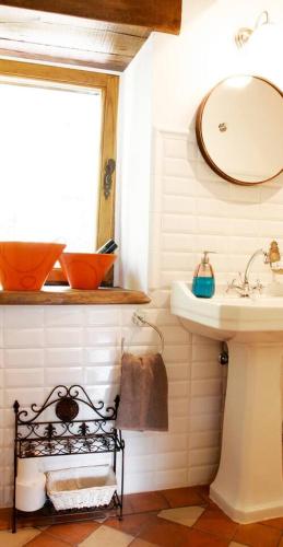 a bathroom with a sink and a mirror at Casa del Conde 2 - Ajanedo in Ajanedo