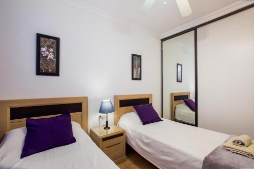 Ένα ή περισσότερα κρεβάτια σε δωμάτιο στο Playa la Arena apartment
